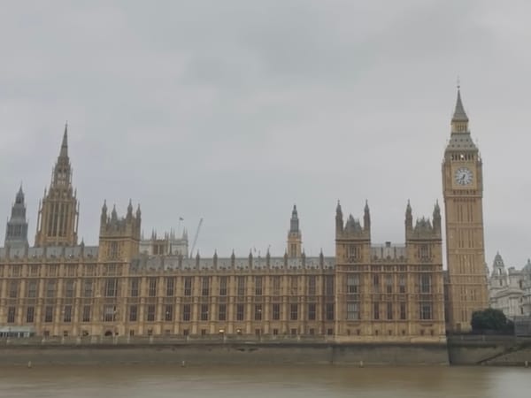 Cloudy day with drizzles, sitting on a bench right across Westminster